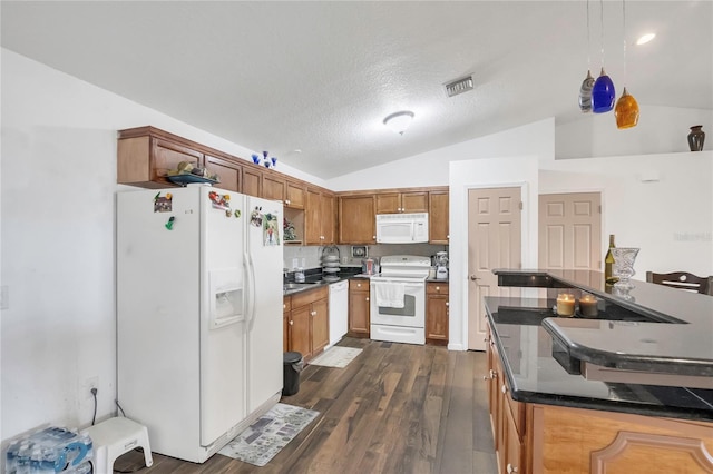 kitchen with white appliances, brown cabinetry, visible vents, dark wood-type flooring, and vaulted ceiling