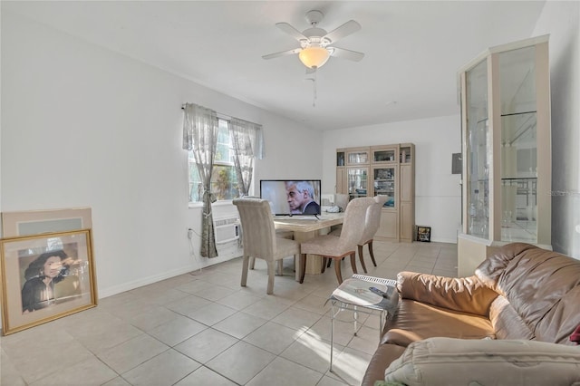 dining space featuring light tile patterned floors, baseboards, and ceiling fan