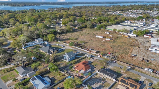 drone / aerial view with a water view and a residential view