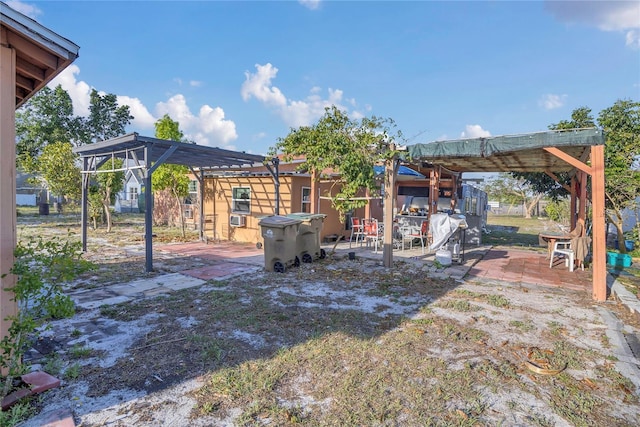 view of yard with a patio area and a pergola