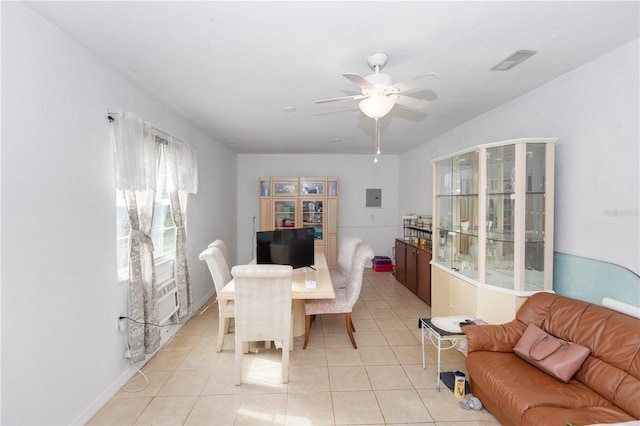 dining area with electric panel, ceiling fan, light tile patterned floors, and visible vents