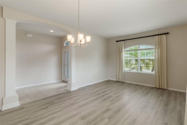 3341 Winchester Estates Cir, Lakeland, FL 33810 - empty room with light wood-style flooring, baseboards, a chandelier, and recessed lighting