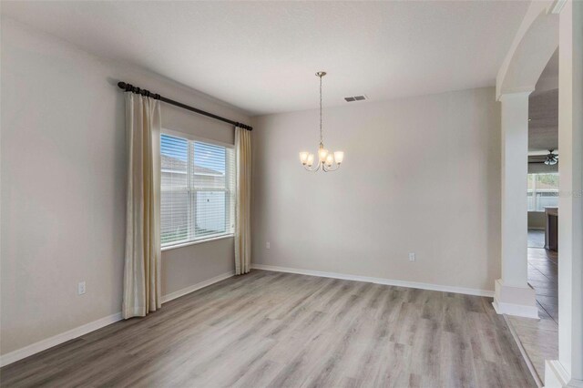 3341 Winchester Estates Cir, Lakeland, FL 33810 - unfurnished dining area featuring plenty of natural light, a chandelier, and light wood-type flooring