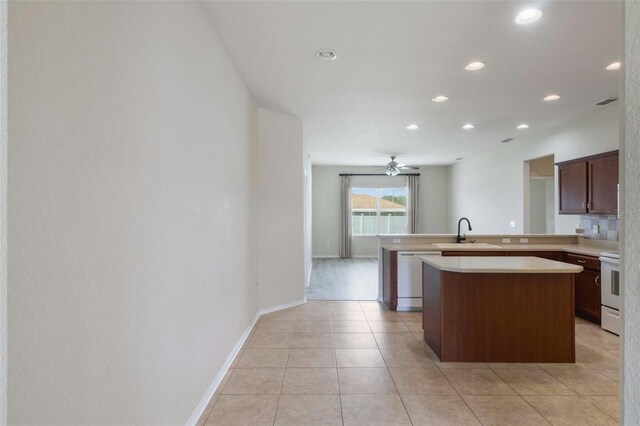 3341 Winchester Estates Cir, Lakeland, FL 33810 - kitchen with dishwasher, a sink, light countertops, recessed lighting, and a peninsula