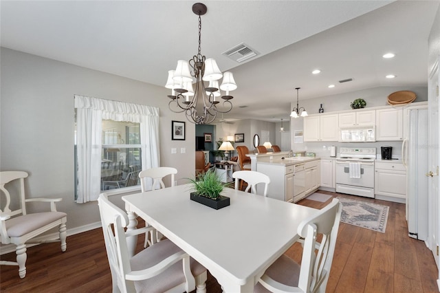 dining space with visible vents, baseboards, a chandelier, recessed lighting, and dark wood-style floors