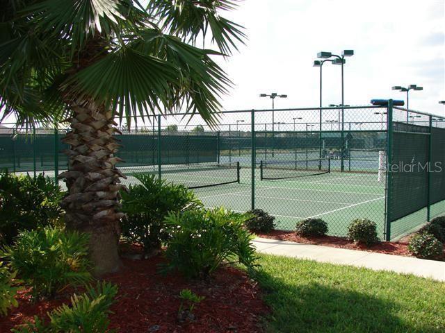 view of tennis court featuring fence