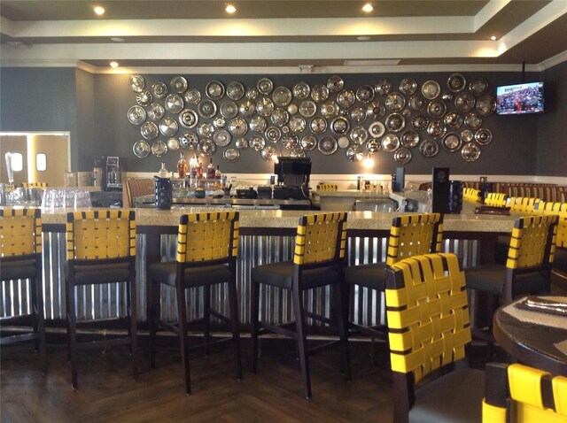 bar featuring wood finished floors and recessed lighting