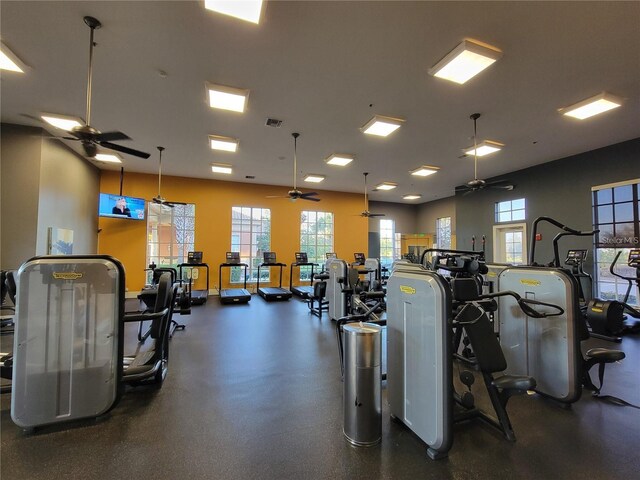 workout area featuring a ceiling fan and visible vents