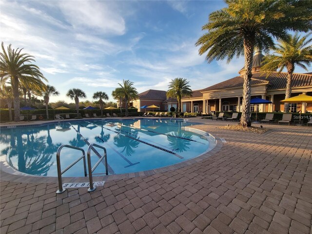 community pool with a patio