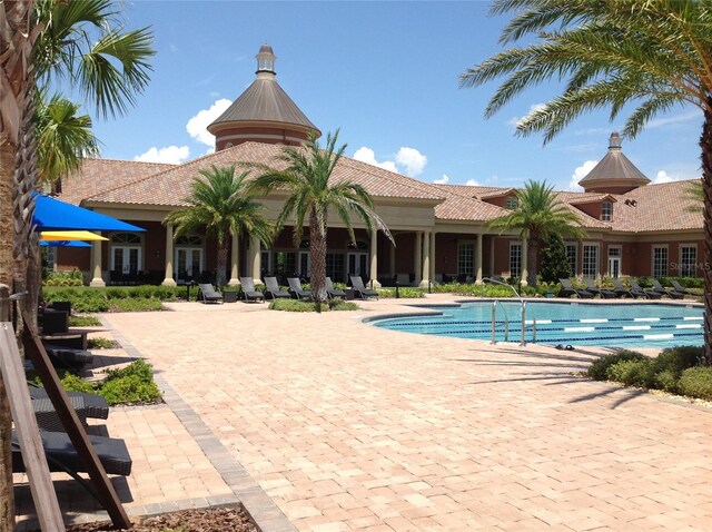 community pool with a patio