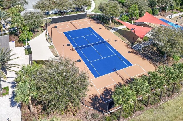 view of tennis court with fence