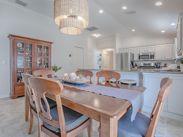 1829 Foxwood Ln, The Villages, FL 32162 - dining area with visible vents, crown molding, a chandelier, lofted ceiling, and recessed lighting