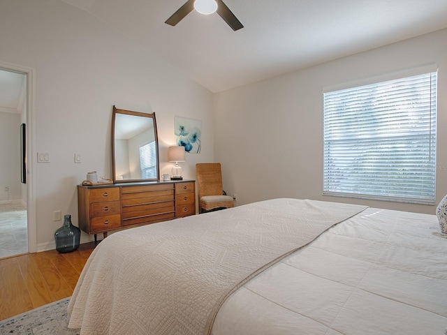 1829 Foxwood Ln, The Villages, FL 32162 - bedroom with baseboards, lofted ceiling, wood finished floors, and a ceiling fan