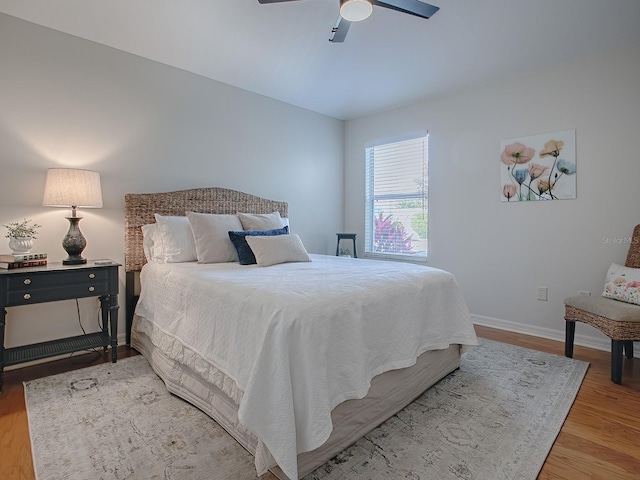 1829 Foxwood Ln, The Villages, FL 32162 - bedroom with baseboards, a ceiling fan, and light wood finished floors