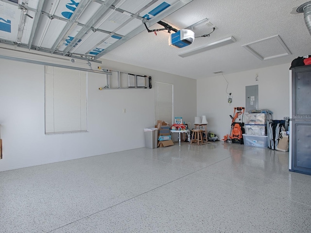 1829 Foxwood Ln, The Villages, FL 32162 - garage featuring electric panel and a garage door opener