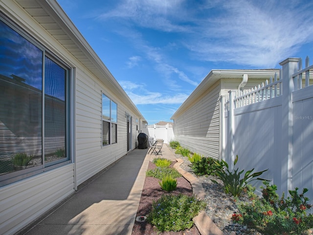 1829 Foxwood Ln, The Villages, FL 32162 - view of property exterior with a patio and fence