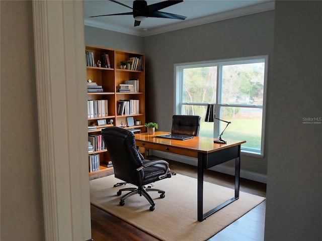 office space featuring baseboards, crown molding, a ceiling fan, and wood finished floors