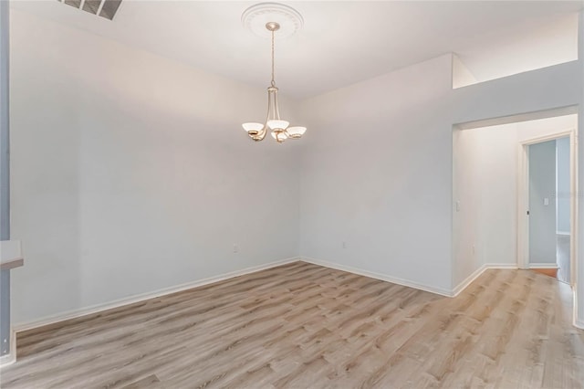 6200 Topsail Rd, Lady Lake, FL 32159 - unfurnished room featuring visible vents, baseboards, a chandelier, and light wood finished floors