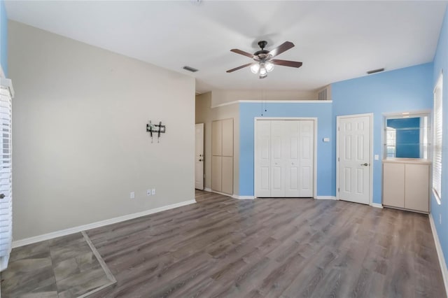 6200 Topsail Rd, Lady Lake, FL 32159 - unfurnished bedroom with visible vents, wood finished floors, baseboards, and vaulted ceiling