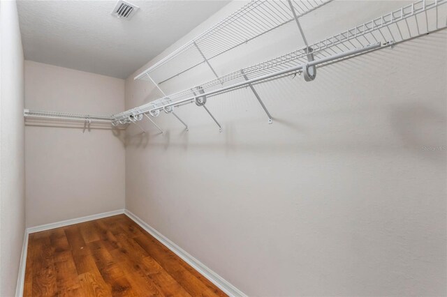 6200 Topsail Rd, Lady Lake, FL 32159 - spacious closet with visible vents and wood finished floors