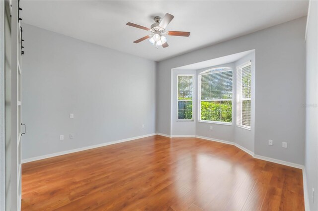 6200 Topsail Rd, Lady Lake, FL 32159 - spare room with a ceiling fan, wood finished floors, and baseboards