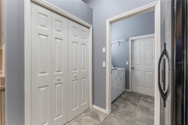 6200 Topsail Rd, Lady Lake, FL 32159 - laundry room featuring laundry area, light tile patterned floors, baseboards, and washing machine and clothes dryer