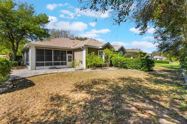 6200 Topsail Rd, Lady Lake, FL 32159 - rear view of property with a yard, a sunroom, and a shingled roof