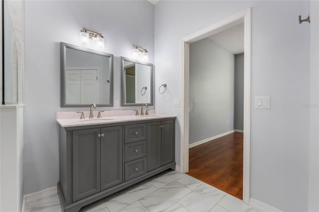 6200 Topsail Rd, Lady Lake, FL 32159 - bathroom featuring a sink, baseboards, marble finish floor, and double vanity