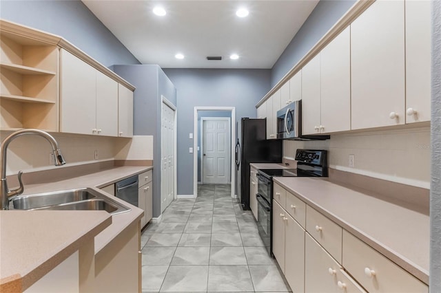 6200 Topsail Rd, Lady Lake, FL 32159 - kitchen featuring visible vents, a sink, stainless steel appliances, white cabinetry, and open shelves