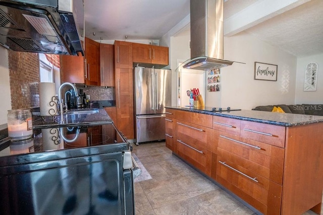 kitchen with exhaust hood, black electric cooktop, a sink, freestanding refrigerator, and island range hood