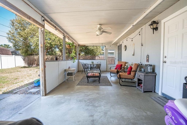 view of patio / terrace with outdoor dining space, fence, and ceiling fan