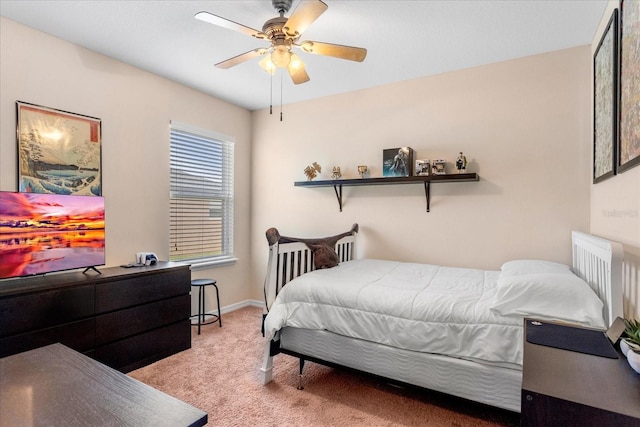 bedroom with baseboards, a ceiling fan, and carpet