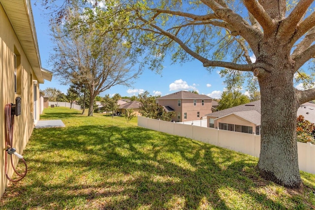 view of yard featuring a residential view and fence