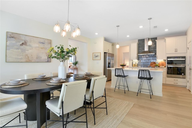 981 Fiesta Key Cir, Lady Lake, FL 32159 - dining area with recessed lighting and light wood-type flooring