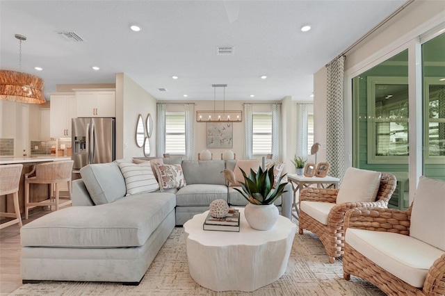 981 Fiesta Key Cir, Lady Lake, FL 32159 - living area with recessed lighting and a chandelier