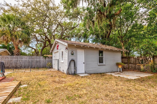 view of outbuilding with an outdoor structure and a fenced backyard