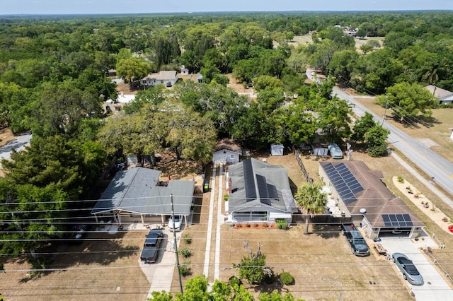 bird's eye view featuring a wooded view