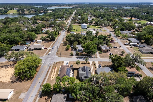 drone / aerial view with a residential view and a water view