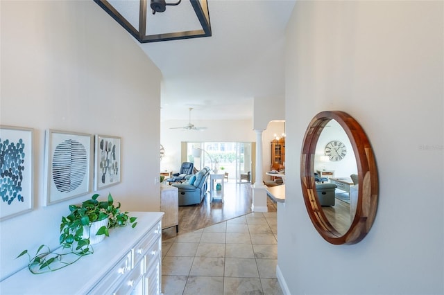 1046 Ridgeland Path, The Villages, FL 32162 - corridor with light tile patterned flooring and ornate columns