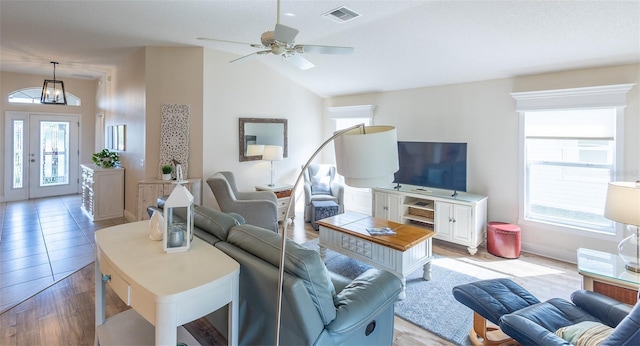 1046 Ridgeland Path, The Villages, FL 32162 - living area featuring visible vents, baseboards, ceiling fan, lofted ceiling, and light wood-type flooring