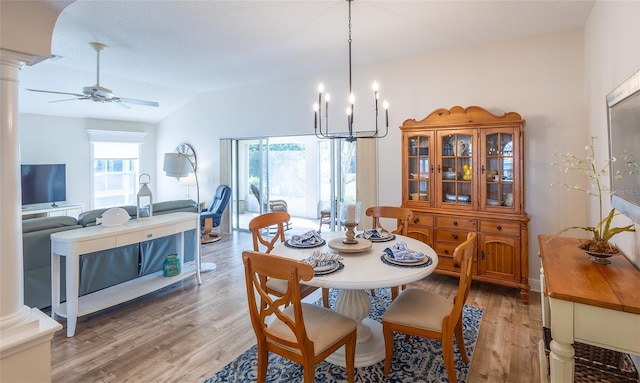 1046 Ridgeland Path, The Villages, FL 32162 - dining area featuring decorative columns, ceiling fan with notable chandelier, lofted ceiling, and light wood-type flooring