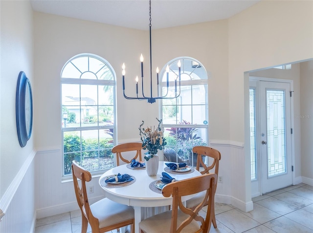 1046 Ridgeland Path, The Villages, FL 32162 - dining space with an inviting chandelier, light tile patterned floors, and a healthy amount of sunlight