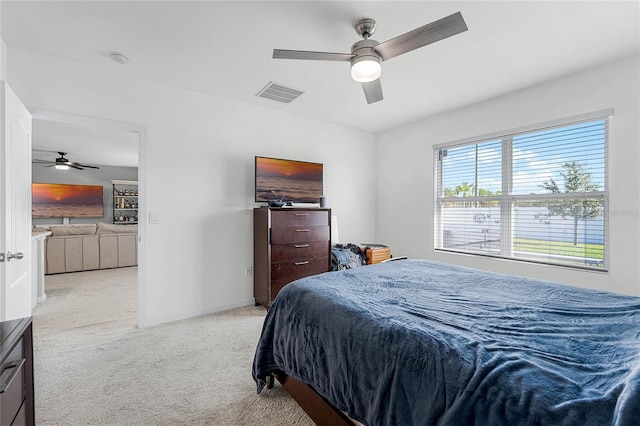 2636 Neverland Dr, New Smyrna Beach, FL 32168 - bedroom featuring visible vents, light colored carpet, a ceiling fan, and baseboards