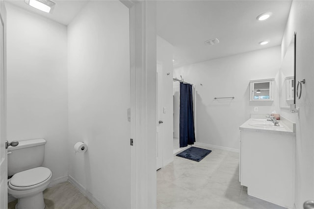 2636 Neverland Dr, New Smyrna Beach, FL 32168 - bathroom featuring vanity, baseboards, visible vents, curtained shower, and toilet