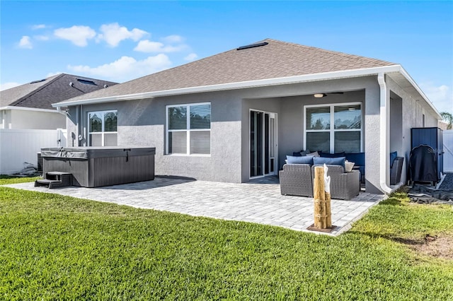 2636 Neverland Dr, New Smyrna Beach, FL 32168 - rear view of property with a patio, fence, stucco siding, a hot tub, and a lawn