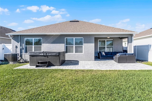 2636 Neverland Dr, New Smyrna Beach, FL 32168 - rear view of house featuring a patio area, central air condition unit, an outdoor hangout area, and a yard