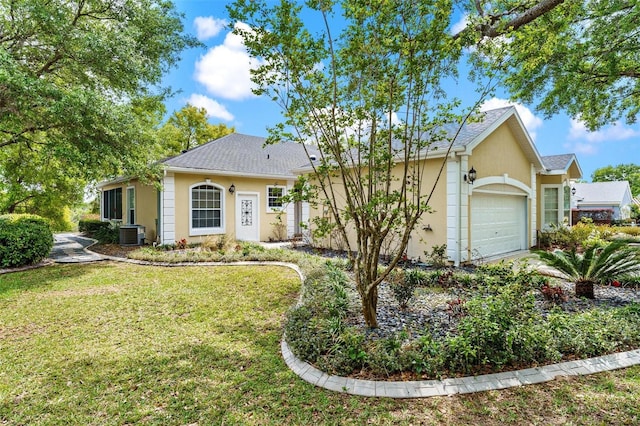 6152 Topsail Rd, Lady Lake, FL 32159 - ranch-style home with central air condition unit, an attached garage, a front lawn, roof with shingles, and stucco siding