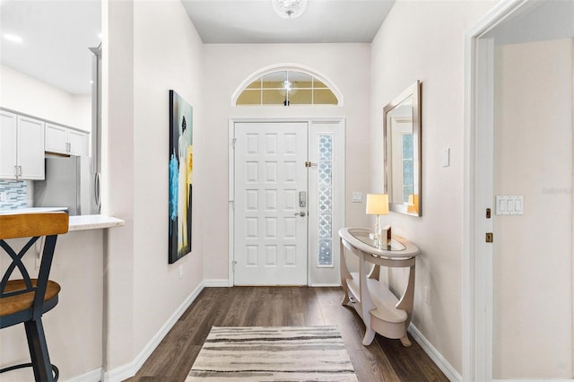 6152 Topsail Rd, Lady Lake, FL 32159 - foyer entrance with baseboards and dark wood-style floors