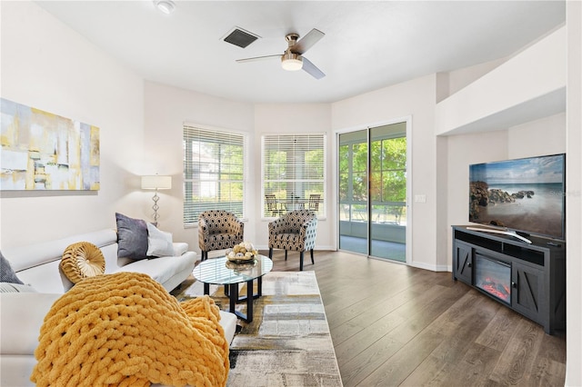 6152 Topsail Rd, Lady Lake, FL 32159 - living room featuring wood-type flooring, visible vents, baseboards, and a ceiling fan