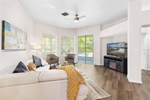 6152 Topsail Rd, Lady Lake, FL 32159 - living room featuring baseboards, visible vents, wood finished floors, and ceiling fan